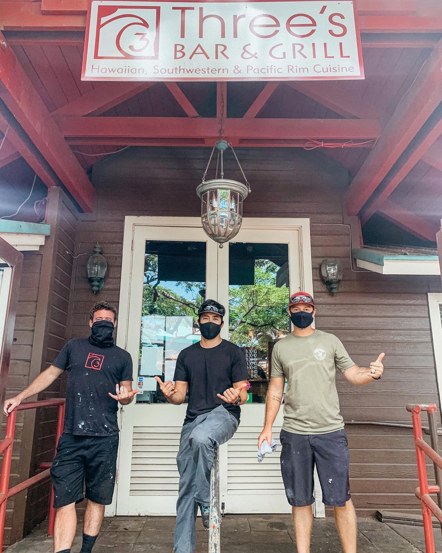 threes bar and grill owners with masks